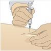 Selection of syringes and needles for intramuscular injection Patient during intramuscular injection